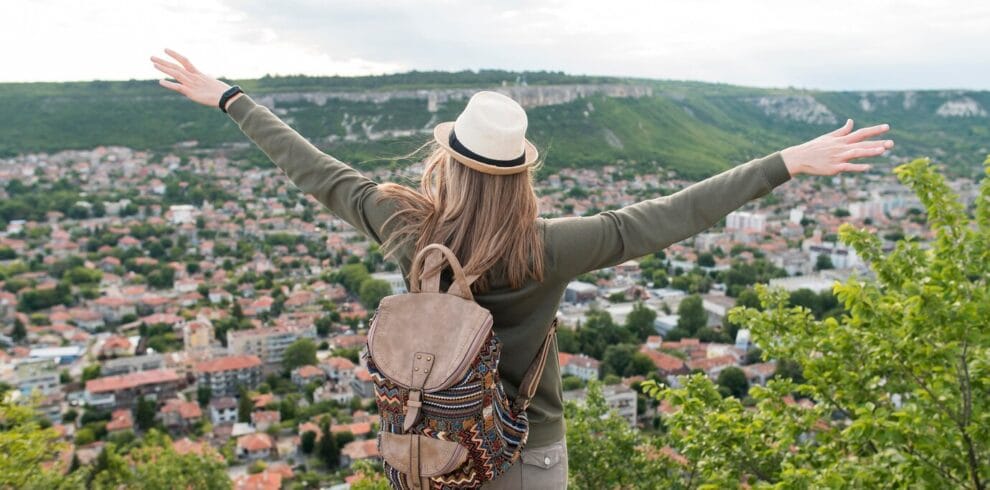 back-view-traveller-with-hat-enjoying-holiday_23-2148588497